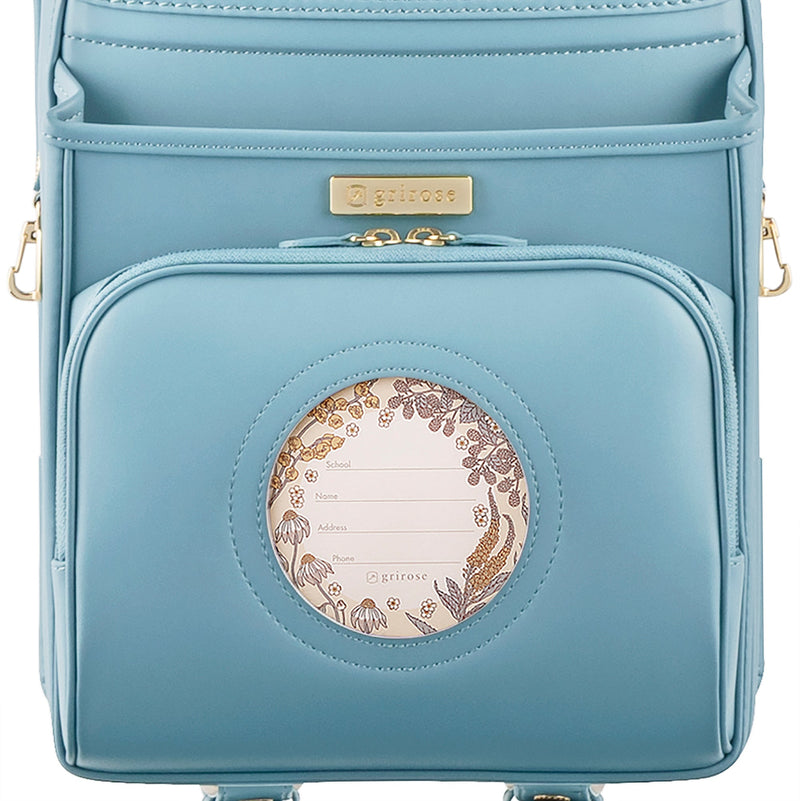 草花がのぞく、おしゃれな円形の窓